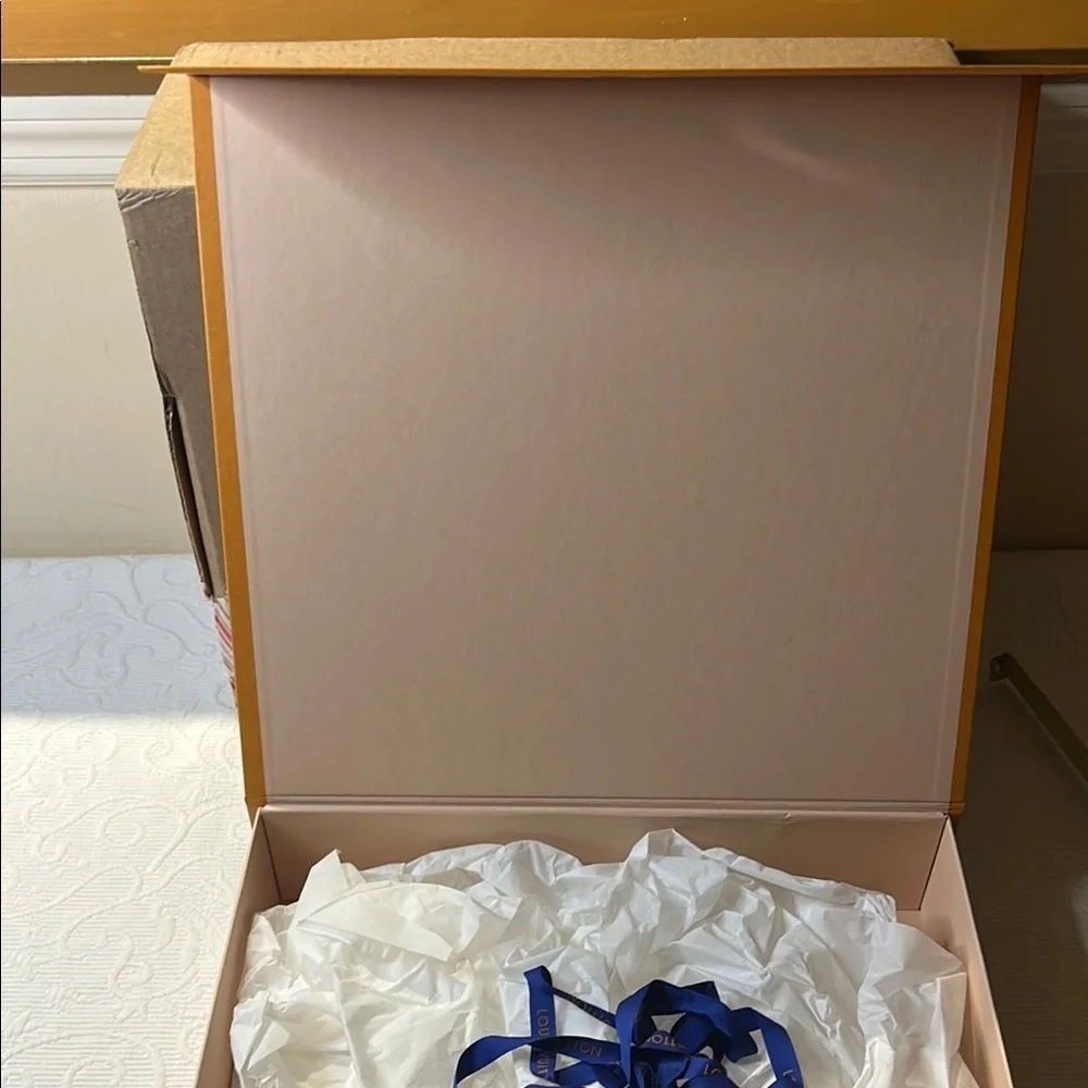 Louis Vuitton Signature  Box inside a LV shipping box with tissue and ribbon.